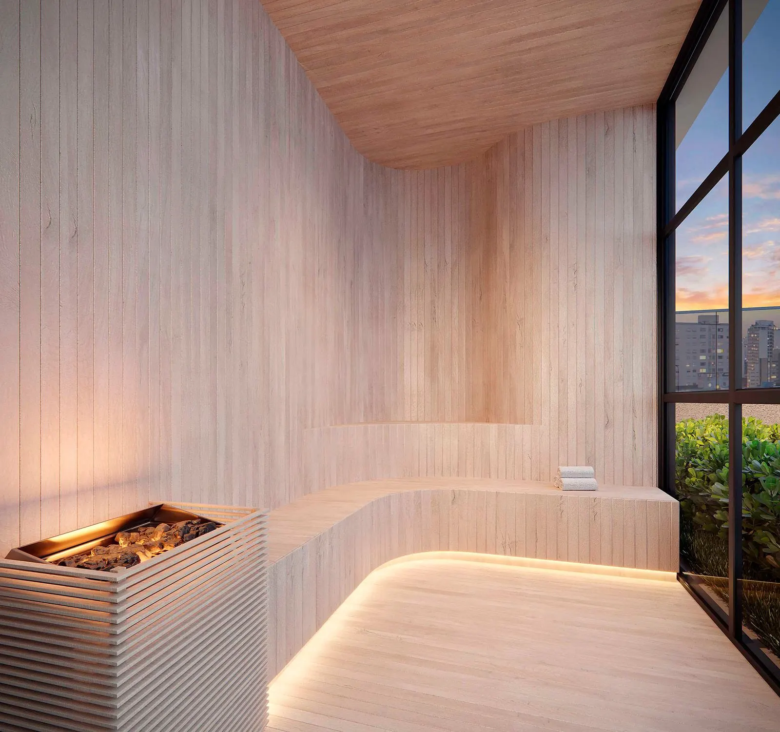 A sauna revestida de madeira clara, com o banco curvo iluminado por baixo e a janela para fora.