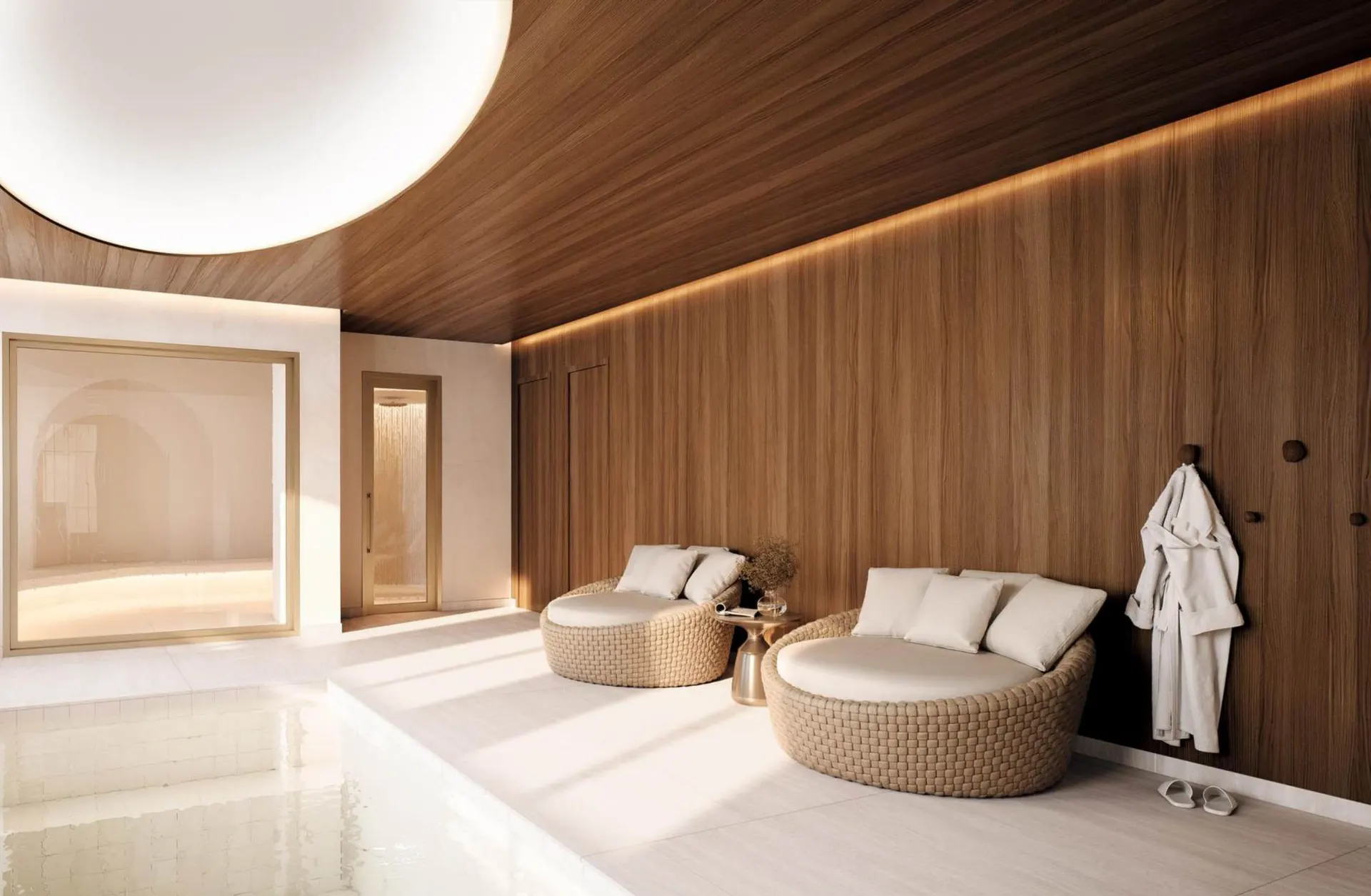 O wellness spa, com a hidromassagem sob uma cúpula de luz e duas poltronas.
