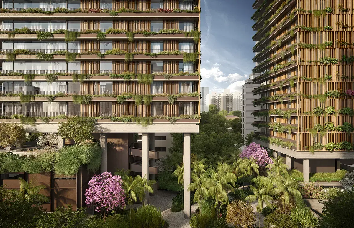 A base das torres: as varandas com jardineiras e ripas de madeira, os pilotis e, entre as duas torres, um jardim com palmeiras e árvores de flores cor-de-rosa.