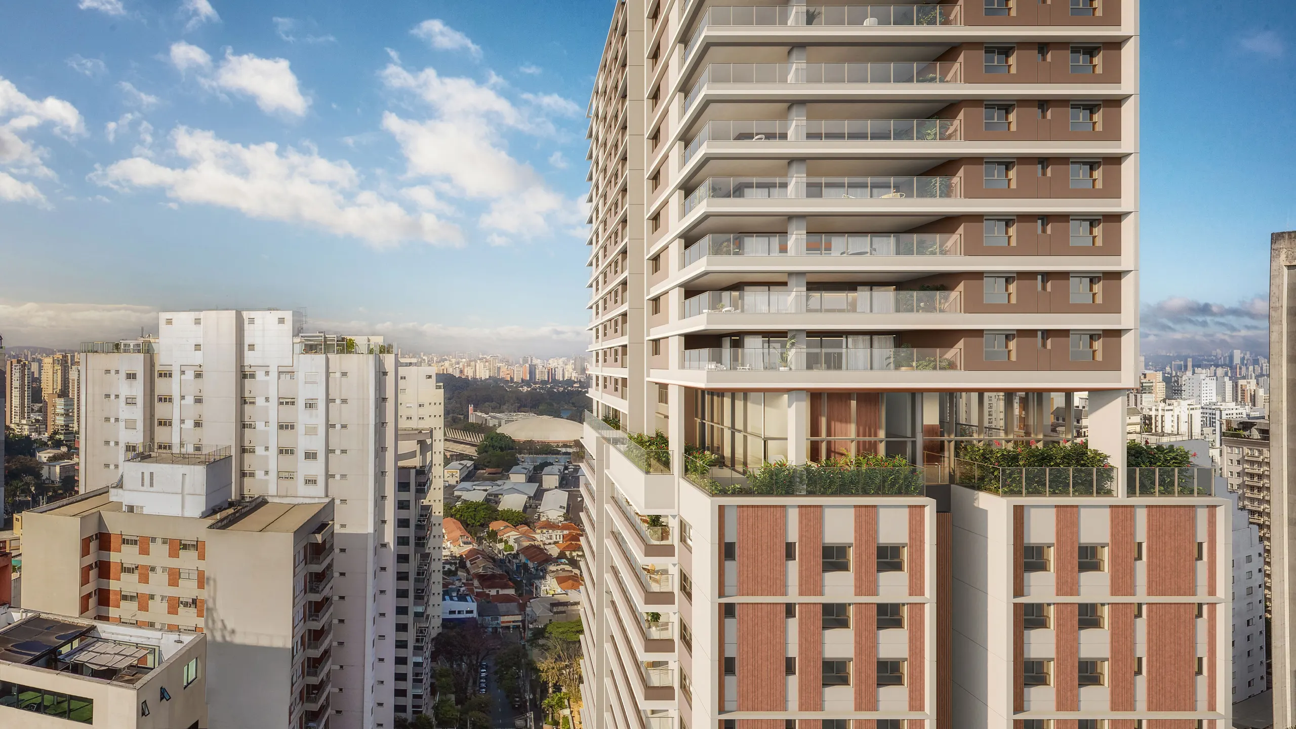 A torre vista do alto na altura do 18º pavimento: o andar de wellness com jardins e vidro, e a cidade e as árvores do Paraíso até o horizonte.