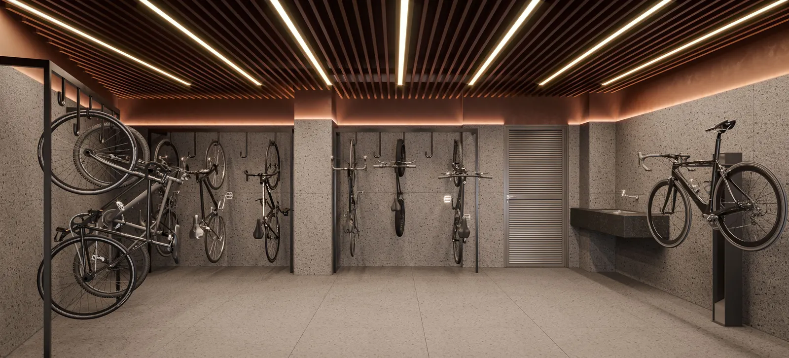 O bicicletário com bicicletas penduradas na parede e o forro de ripas iluminadas.