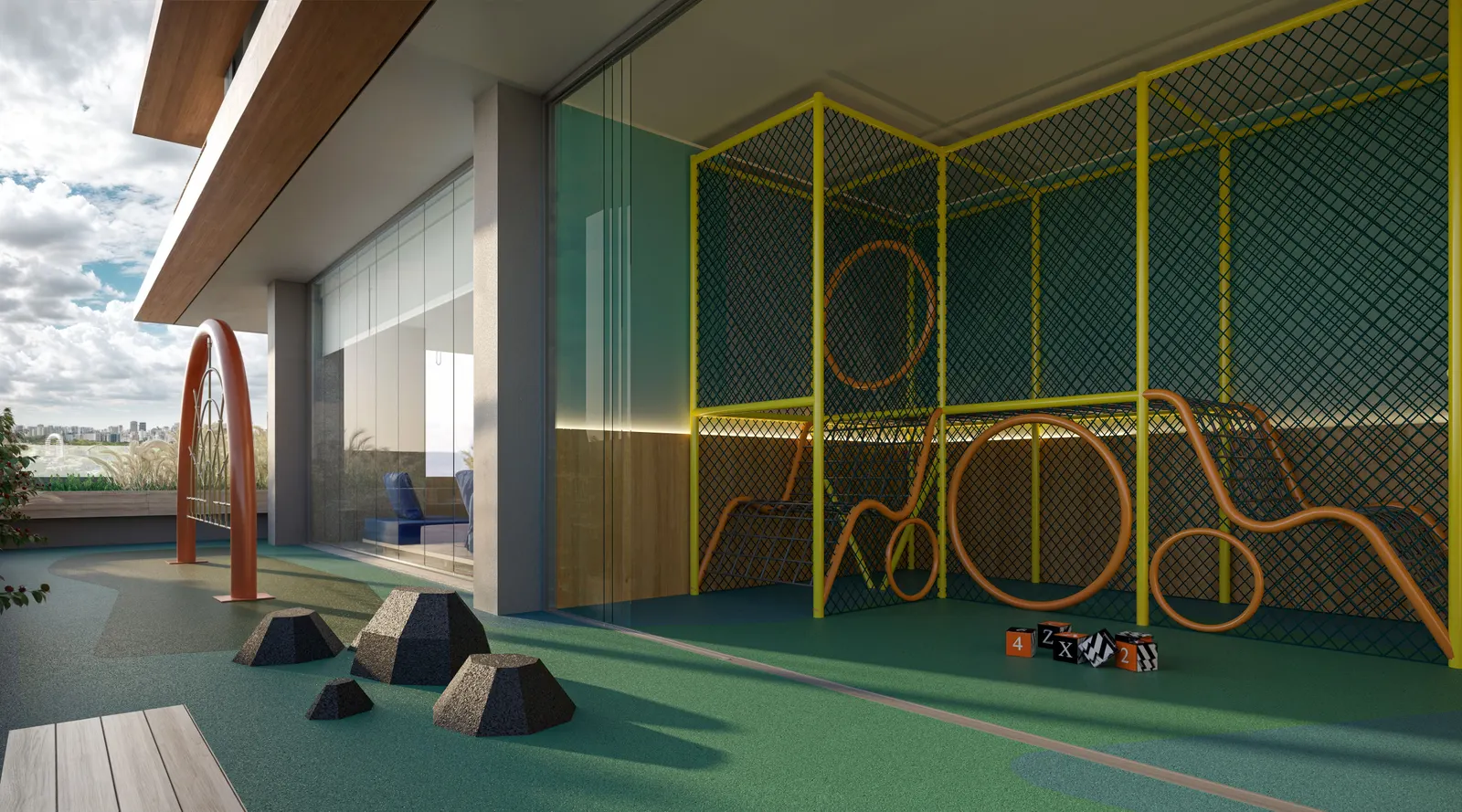 A brinquedoteca integrada ao playground, com estruturas amarelas de escalar sobre o piso emborrachado verde.