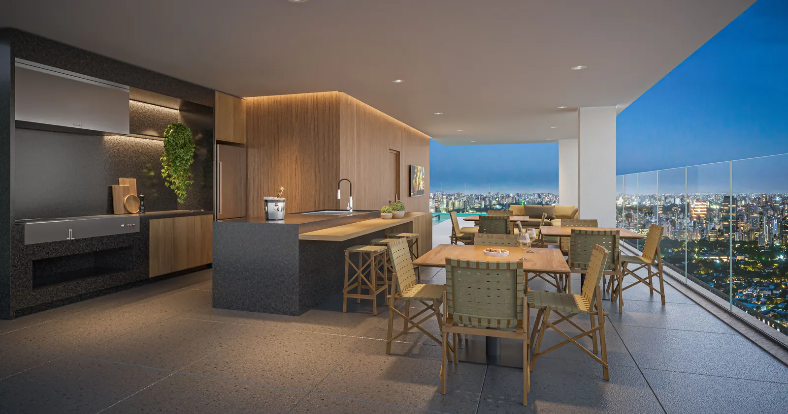 O espaço gourmet do rooftop com mesa de madeira, bancada escura e a vista pela parede de vidro.